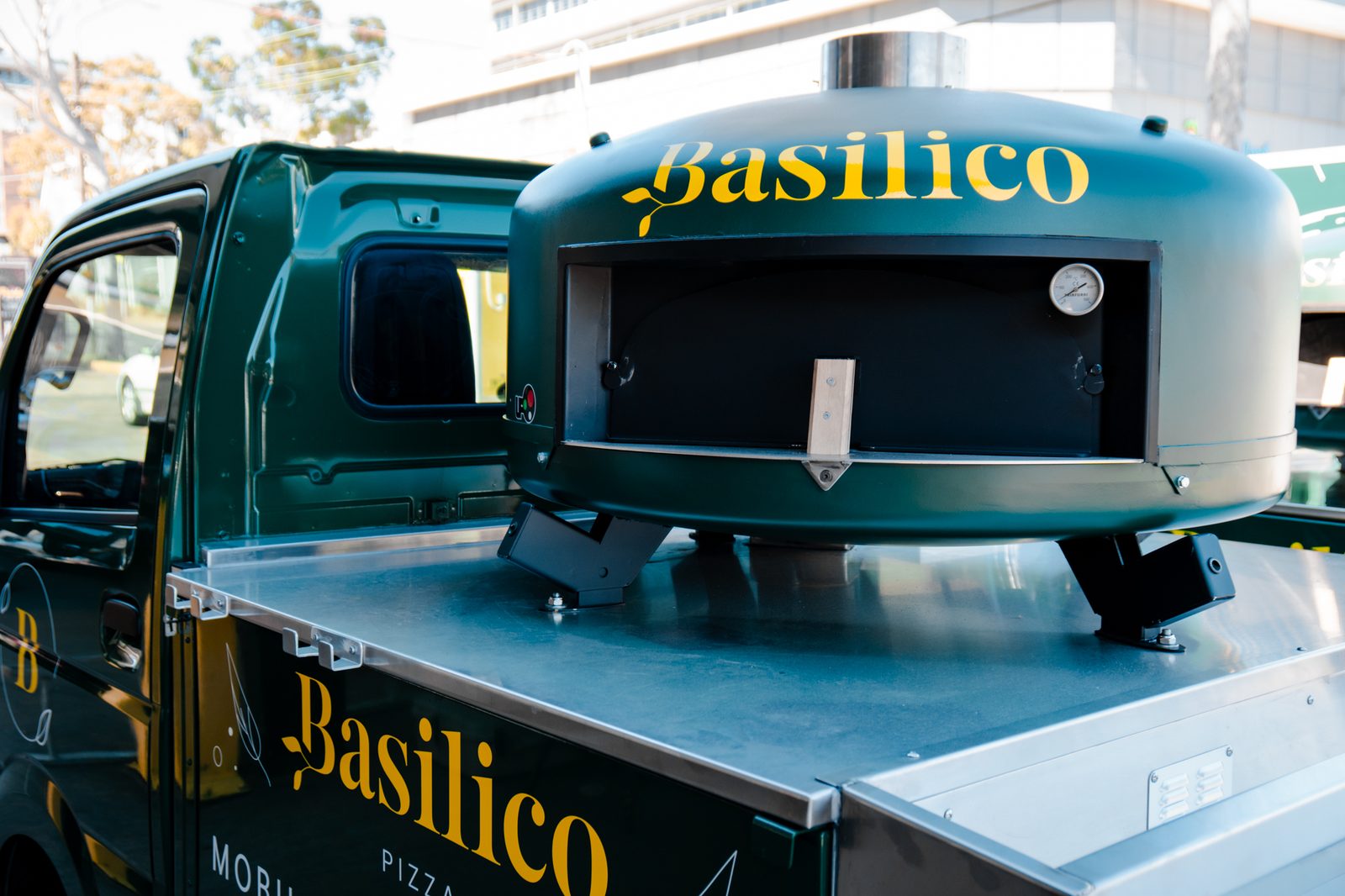 Basilico mobile wood-fired pizza truck with its oven on the tray