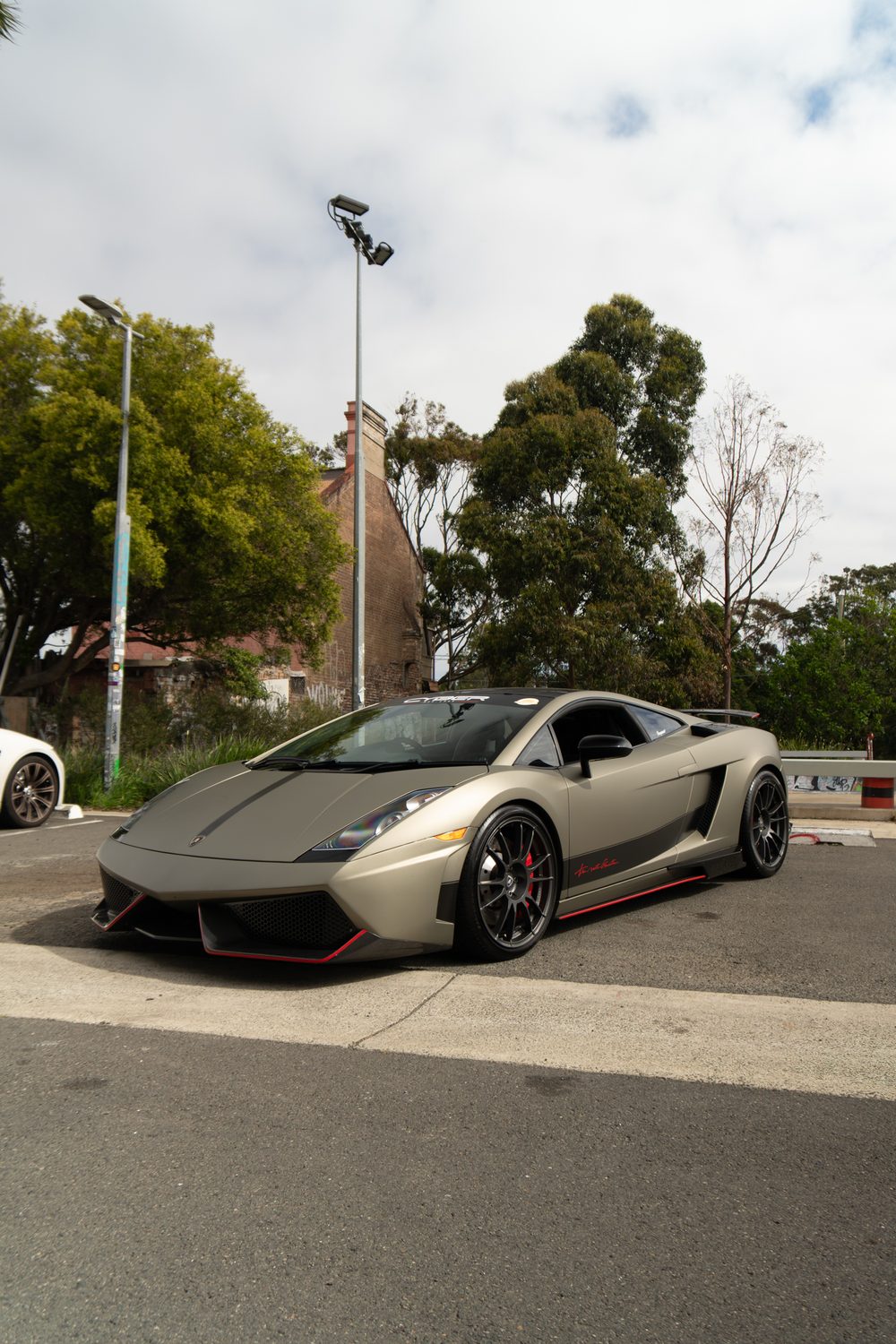 Matte grey Lamborghini Gallardo, front three-quarter view
